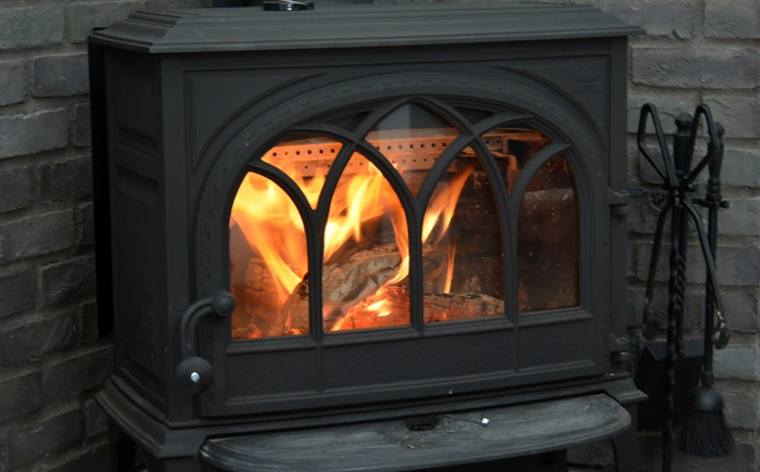 black wood stove with fire tools
