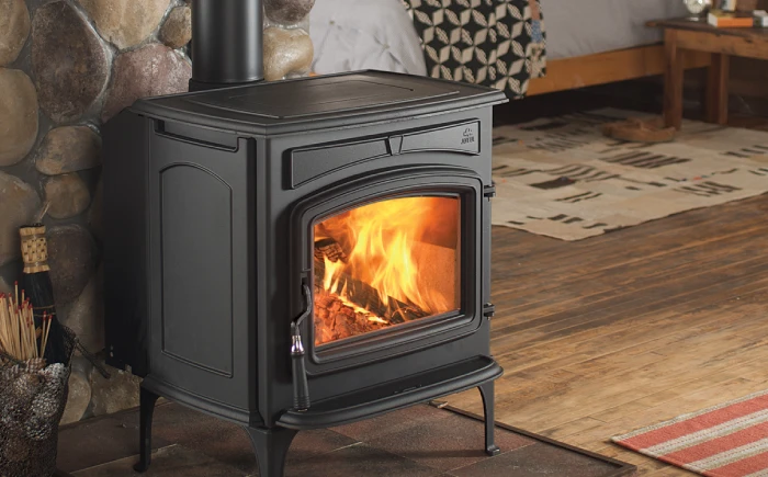 black wood stove with fire tools
